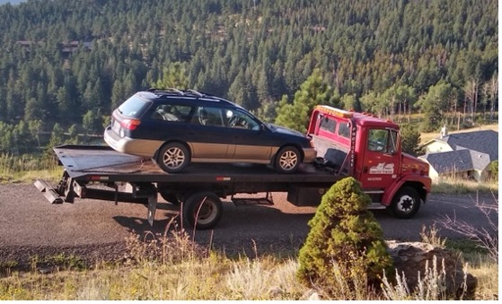 A car on a tow truck.